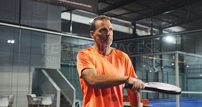 Buy stock photo Padel, sports and mature man for game, tournament and competition on indoor court. Tennis, athlete and senior person with racket for training, exercise and workout for challenge, practice and fitness