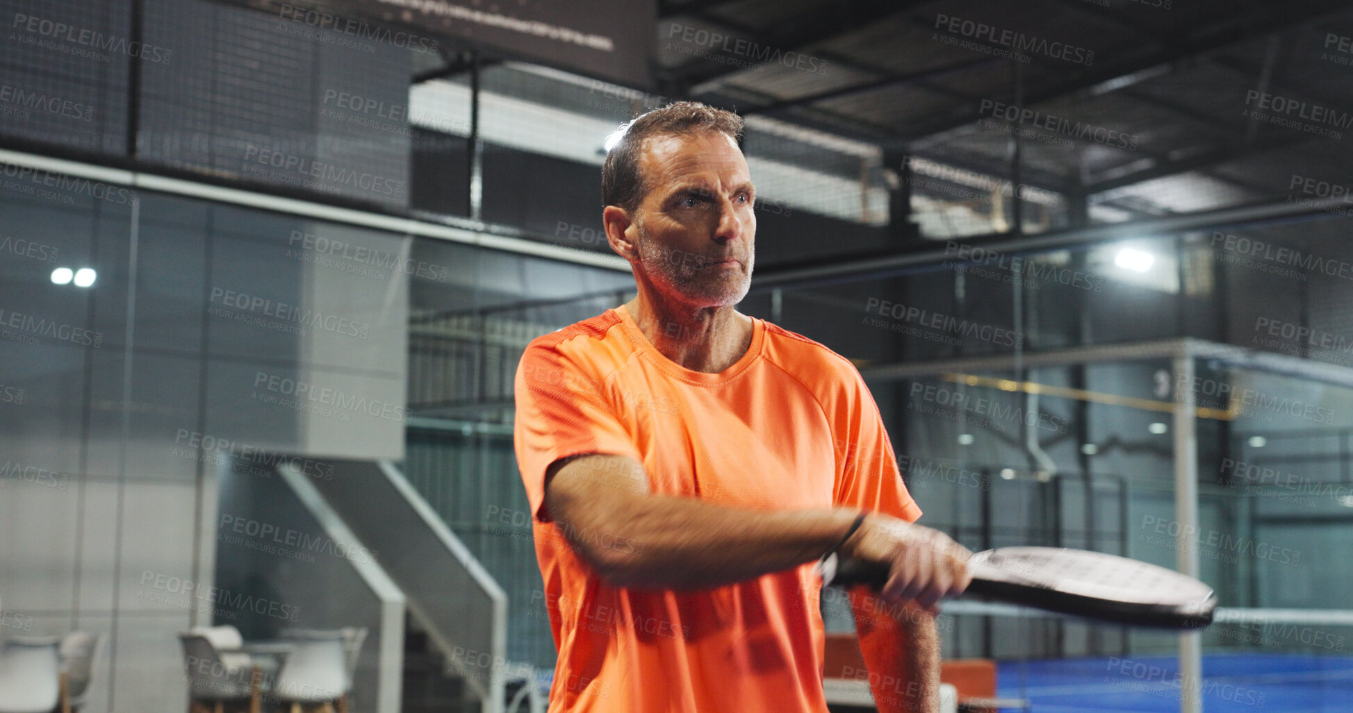 Buy stock photo Padel, sports and mature man for game, tournament and competition on indoor court. Tennis, athlete and senior person with racket for training, exercise and workout for challenge, practice and fitness
