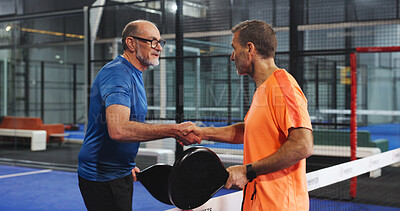 Buy stock photo Padel, men and athletes with handshake, court and gesture for friendly match, fitness and challenge. Tennis players, greeting and shaking hands for competition, mature people and together for game