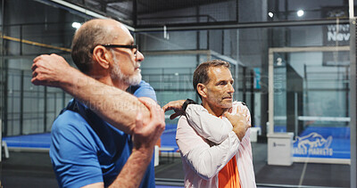 Buy stock photo Padel, sports and men on court stretching to prepare for game, match and competition. Indoor, fitness and mature people warm up for exercise, workout and training for practice, health and tennis
