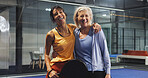 Padel, sports and portrait of women hug for game, match and training for challenge. Indoor court, happy and mature people with racket for workout, exercise and fitness for tennis, practice and hobby