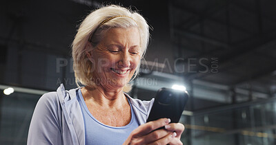 Buy stock photo Sport, woman and happy with phone on court for training update, padel break or practice progress. Tennis player, mature person or smile with smartphone at indoor health club for fitness chat or flare
