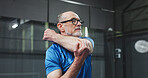 Fitness, padel and old man stretching on court for game preparation, start practice and workout. Retirement health, senior person or arm warm up at indoor tennis club for sport performance or agility