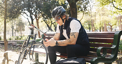 Buy stock photo Delivery, bike and man in city, smartphone and internet with ecommerce app for food. Outdoor, person and employee with cellphone, cyclist and sustainable transport with online review for services