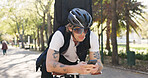 Delivery, bike and phone with man in park for package distribution, courier route app and shipping. Online order, cycling and ecommerce parcel with person and mobile outdoor for export and cargo