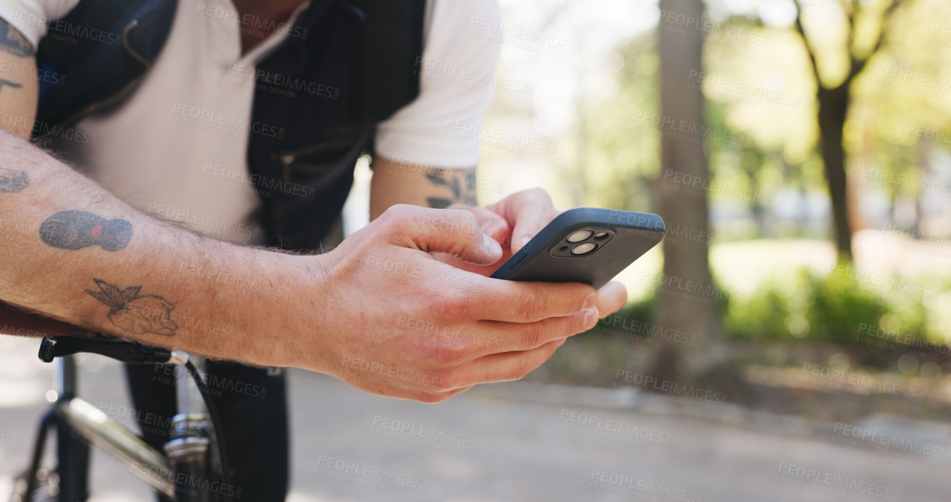 Buy stock photo Hands, phone and texting with bike at park with digital map, search and cycling with scroll in nature. Person, smartphone and rest on bicycle with mobile app, click or location for travel in summer