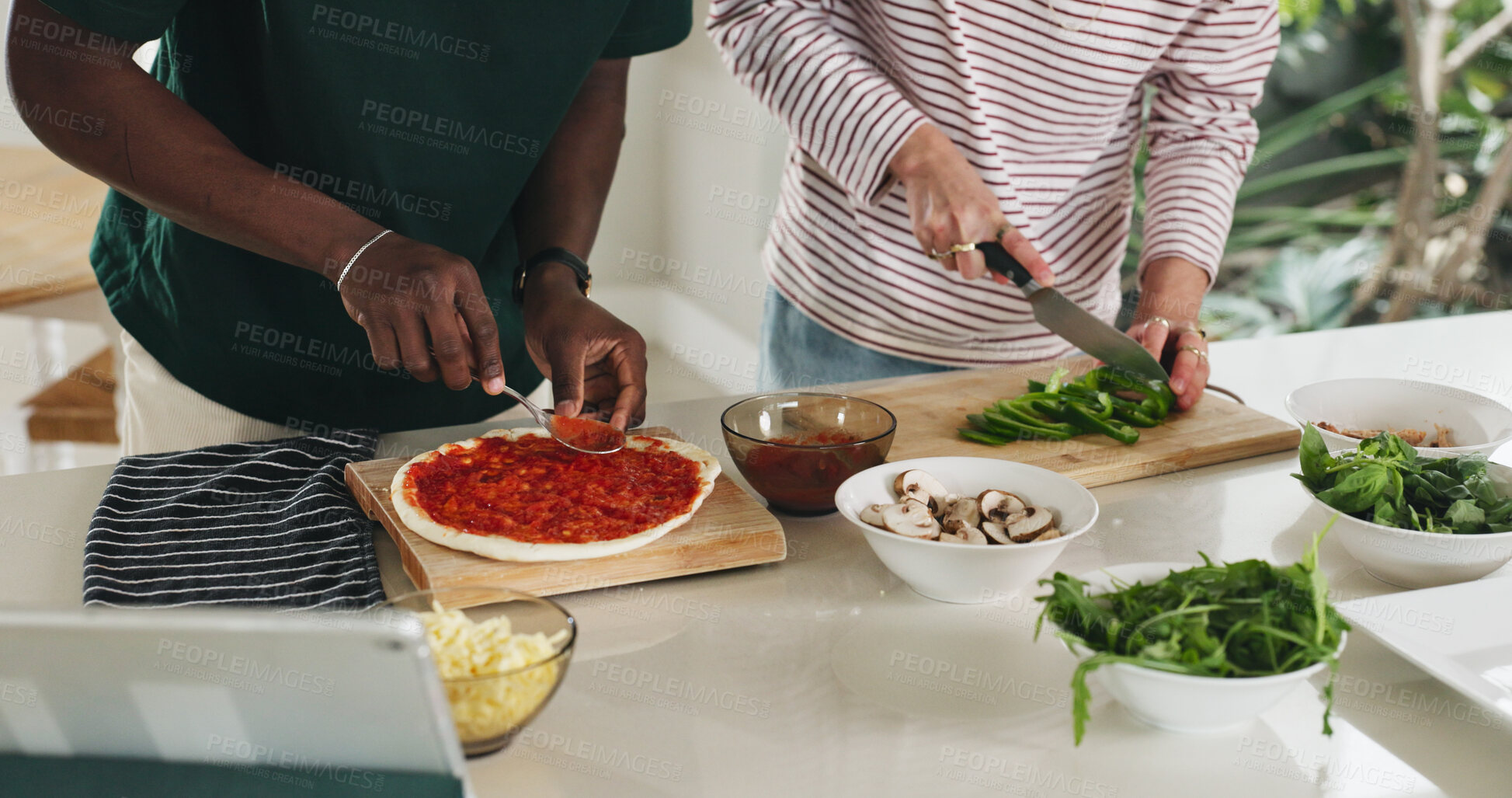 Buy stock photo Cooking, hands and pizza with friends in kitchen of home together to follow online recipe tutorial. App, tablet and video instructions with roommates in apartment for food or meal preparation