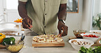 Hands, person and cooking pizza in home with meal prep, organic ingredients and healthy food. Chef, dough and cheese for Italian cuisine, vegetables toppings and culinary skills for homemade lunch