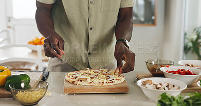 Buy stock photo Hands, person and cooking pizza in home with meal prep, organic ingredients and healthy food. Man, dough and cheese for Italian cuisine, vegetables toppings and culinary skills for homemade lunch