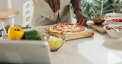 Buy stock photo Hands, person and cooking pizza at house with meal prep, organic ingredients and healthy food. Chef, tablet and cheese toppings for Italian cuisine, vegetables and culinary skills for homemade lunch