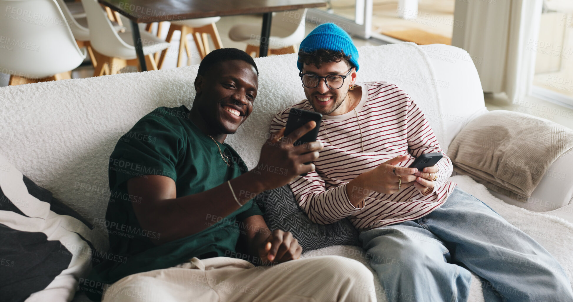 Buy stock photo Break, phone and sharing with friends on sofa in living room of home together for social media. App, relax and smile with roommate people in apartment for browsing, internet search or streaming