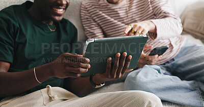Buy stock photo Home, hands and men on sofa, tablet and funny meme with connection, relax and social media. Apartment, friends and people on couch, happiness and technology with online humor, comedy and internet
