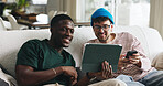 Break, sharing and tablet with friends on sofa in living room of home together for social media. App, showing and smile with roommate people in apartment for browsing, internet search or streaming