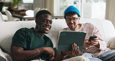Buy stock photo Break, sharing and tablet with friends on sofa in living room of home together for social media. App, showing and smile with roommate people in apartment for browsing, internet search or streaming