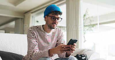 Buy stock photo Smile, phone and man on couch in home with social media, contact or scrolling for networking. Notification, tech and male person with cellphone for connectivity, online or mobile app in living room