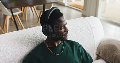 Buy stock photo Above, headphones or black man on sofa, thinking or listening to music, daydreaming or podcast. Playlist album, home or African person with audio, sound or radio with contemplation or relax in lounge