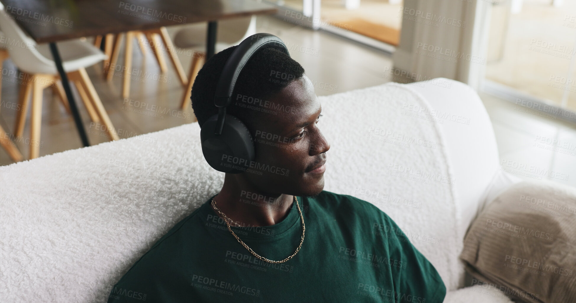 Buy stock photo Above, headphones or black man on sofa, thinking or listening to music, daydreaming or podcast. Playlist album, home or African person with audio, sound or radio with contemplation or relax in lounge