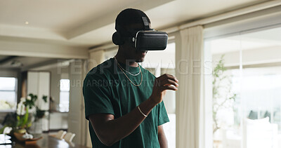 Buy stock photo Gaming, metaverse and virtual reality with black man in home for interactive or online experience. Immersive, video game and vr headset with African person in apartment for futuristic entertainment