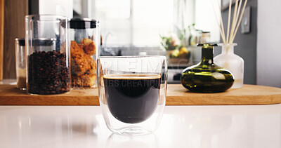 Buy stock photo Coffee, glass and morning in kitchen for strong caffeine, drink or roast in home. Organic brew, beans and blend with countertop for mocha, espresso or breakfast beverage in house for preparation