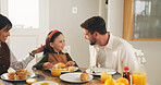 Breakfast, eating and smile with happy family in dining room of home together for meal or nutrition. Bonding, food or morning with mother, father and daughter in apartment for diet, health or hunger