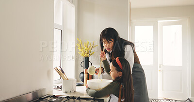 Buy stock photo Bake, mother and girl in kitchen, help and bonding together with happiness, learning and ingredients. Family, home or parent with mama, daughter or cooking with recipe, love or support with utensils