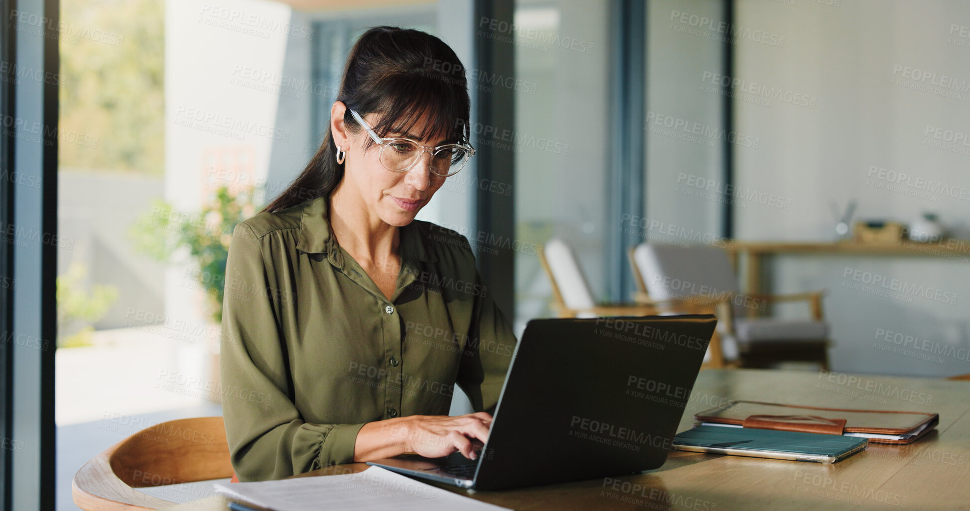 Buy stock photo Business, woman and typing with laptop at house for real estate, property report and research. Mature freelancer, pc and paperwork for sales agreement, listing information and negotiation statement