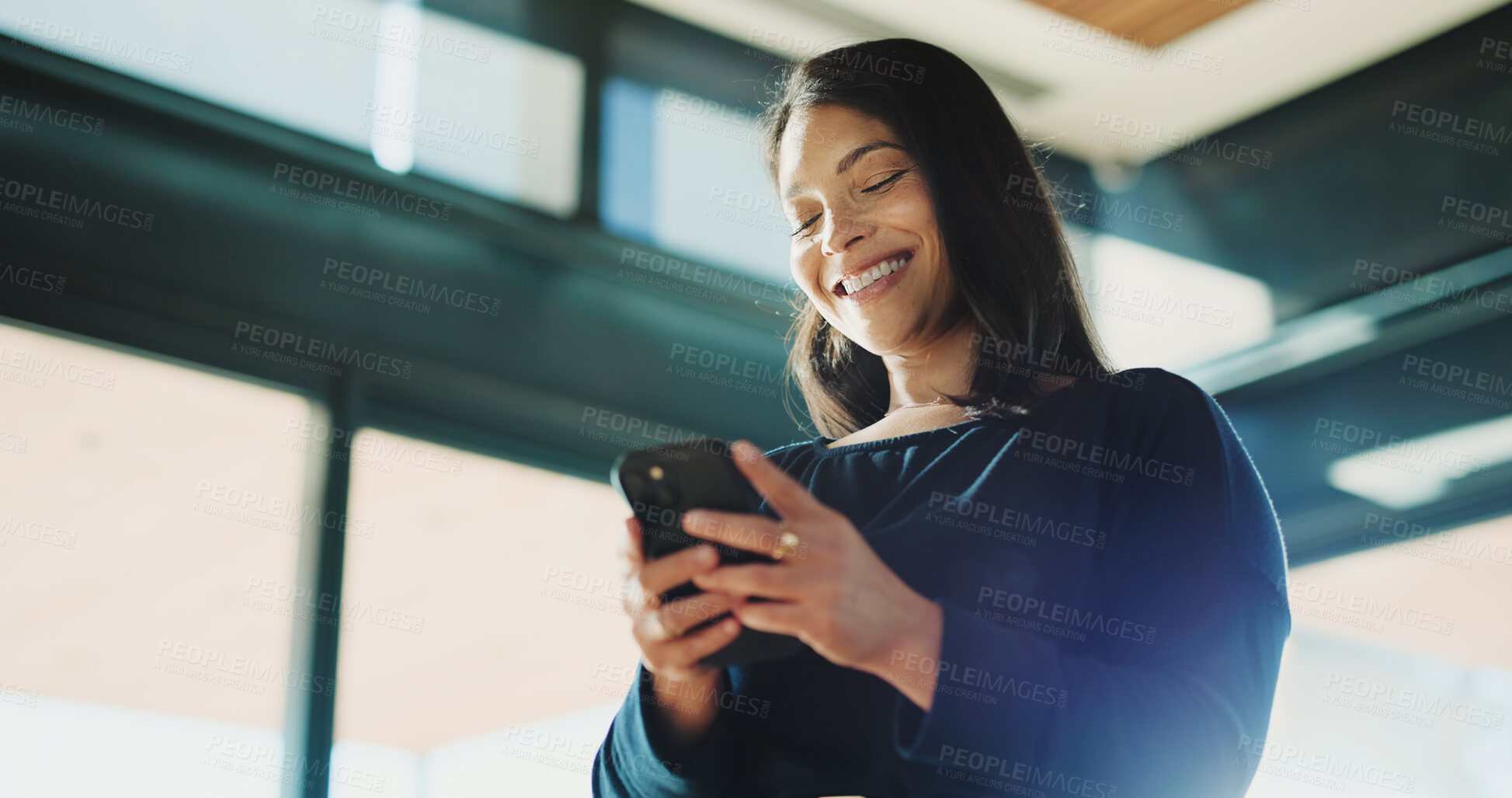 Buy stock photo Below, business and woman with smartphone, smile and media agency with positive review. Person, low angle and journalist in office, cellphone and connection with internet, online publication or app