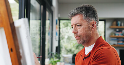 Buy stock photo Painting, artist or canvas by window for creativity project, visual expression or concentration for craft. Calm, freelancer or mature man with brush for artistic activity, creation or talent in home