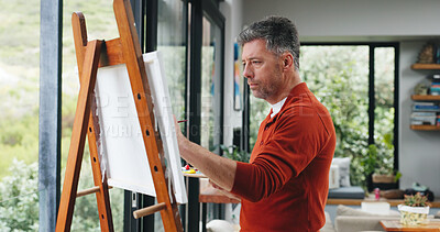 Buy stock photo Painting, man or canvas by window for creativity project, visual expression or concentration for craft. Calm, freelancer or mature artist with brush for artistic activity, creation or talent in home