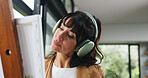 Painting, headphones or woman in home with hobby, streaming or music inspiration for artwork. Creative outlet, tech or mature artist in house with canvas, radio or craft podcast for visual expression