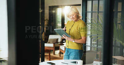 Buy stock photo Home, mature woman and writing on tablet for chapter revision, editing submission and remote work. Freelancer, author and stylus with flare for article review, proofreading and publication feedback