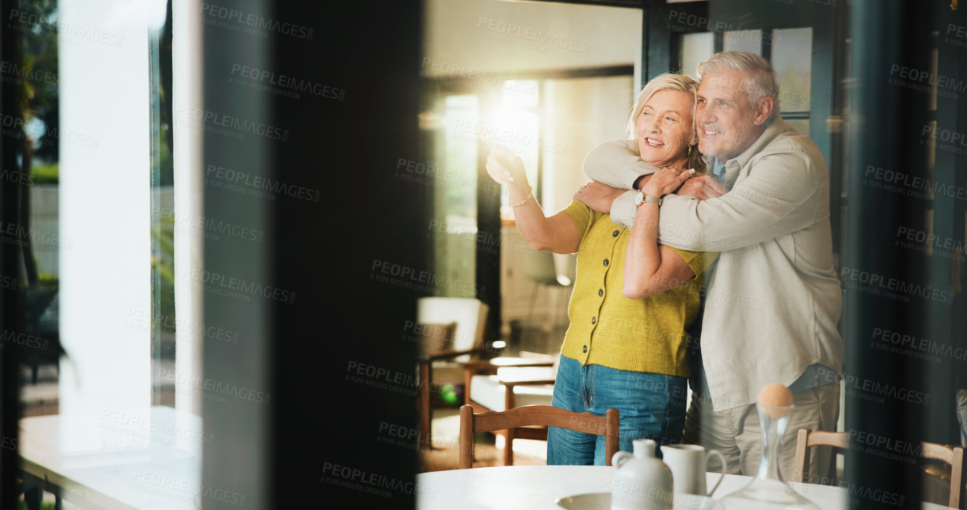Buy stock photo Hug, smile and love with old couple in home for support, retirement and bonding. Marriage, connection and happiness with senior man and woman in house for loyalty, commitment and trust together