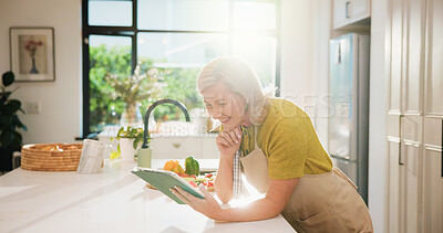 Buy stock photo Senior, woman and online recipe with tablet for cooking tutorial or healthy food in home kitchen. Elderly, female person or flare with technology or ingredients for natural organic snack or meal prep