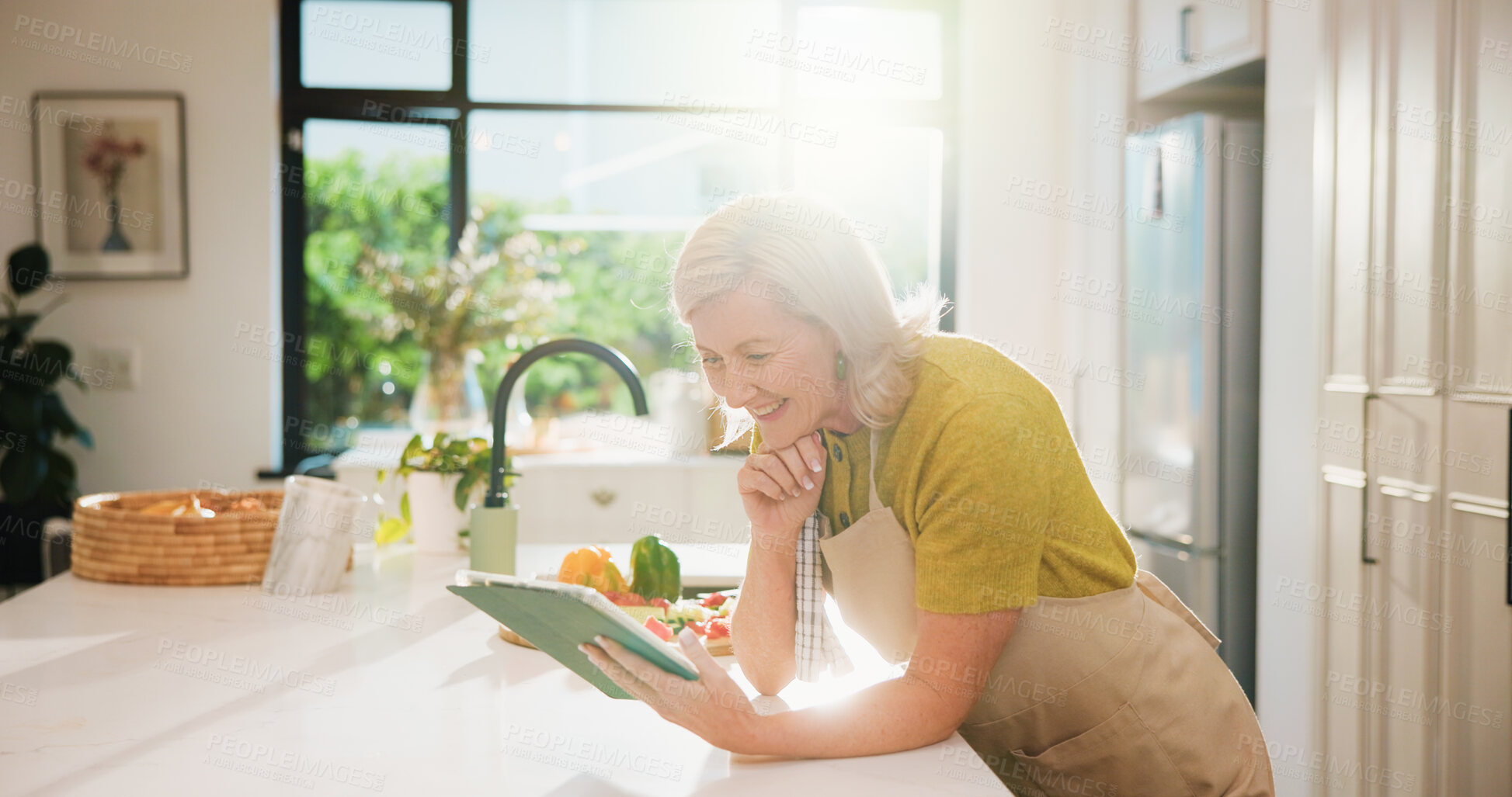 Buy stock photo Senior, woman and online recipe with tablet for cooking tutorial or healthy food in home kitchen. Elderly, female person or flare with technology or ingredients for natural organic snack or meal prep
