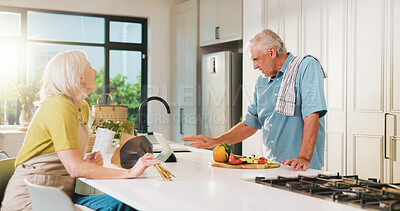 Buy stock photo Tablet, flowers and cooking with old couple in kitchen of home for anniversary celebration, romance and gift. Love, present and online recipe with senior man and woman in house for date and meal prep