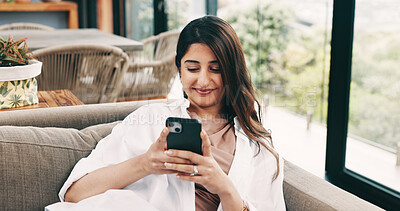 Buy stock photo Happy, woman and relax with phone at house for social media, browsing website and texting contact. Person, resting and mobile to download game, online notification and chat for message update on sofa
