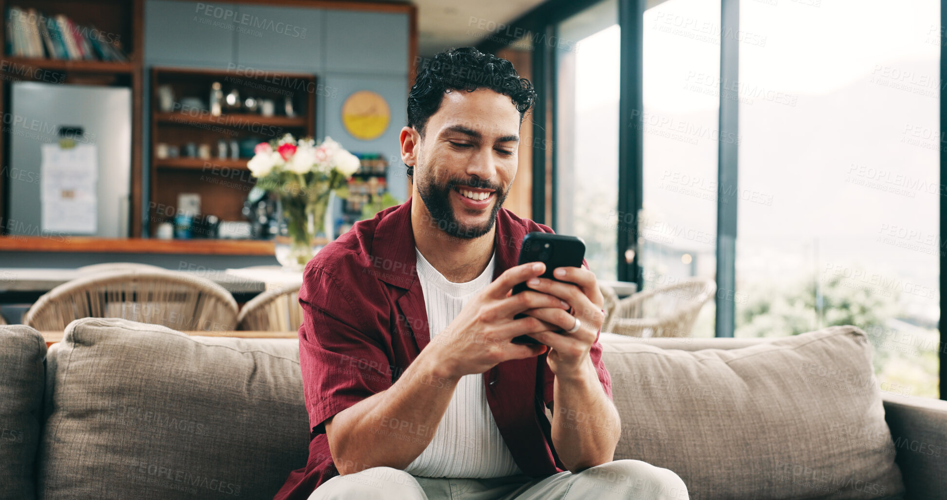 Buy stock photo Smile, man and relax with phone at house for social media, browsing website and texting contact. Male person, rest or mobile to download game, online notification and chat with message update on sofa