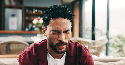 Buy stock photo Frustrated man, headache and eye strain with pain on sofa for burnout, fatigue or stress in home. Tired, male person or vertigo with sore head, injury or migraine for dizziness, anxiety or pressure