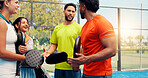 Conversation, fitness and padel with friends on court together for hobby, practice or training. Exercise, sports and tennis with group of people talking outdoor for game, match or strategy advice