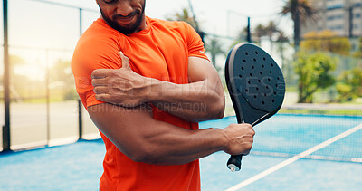 Buy stock photo Padel court, hands and man with shoulder pain, racket and inflammation with sports injury. Person, athlete or tennis player with sprain, recovery and joint tension with muscle strain and fibromyalgia