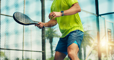 Buy stock photo Padel court, hands and man for fitness, training and outdoor performance. Tennis, cardio game and workout or club competition with person in match for athlete, exercise and low angle of tournament