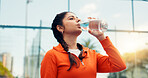 Tennis player, woman outdoor or drinking water with bottle, sports hydration or competition break. Active, person or padel athlete on court with beverage for electrolytes, tournament rest or recovery