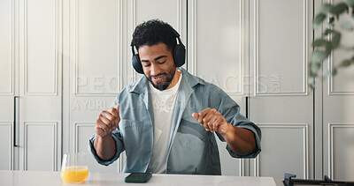 Buy stock photo Dance, headphones and phone with man in kitchen of home for audio streaming or entertainment. App, music and rhythm with happy person at counter in apartment for listening, me time break or relax