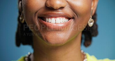 Buy stock photo Smile, dentistry and teeth of woman in studio with oral hygiene, veneers or tooth whitening. Happy, orthodontics and mouth of person with dental care for wellness with fresh breath by blue background