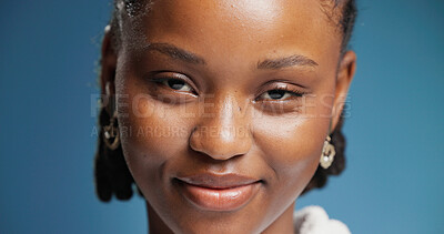 Buy stock photo Smile, woman and portrait with confidence in studio with positive attitude, calm and pride. Face, African female person or happy model on blue background with expression, good mood and wellness.