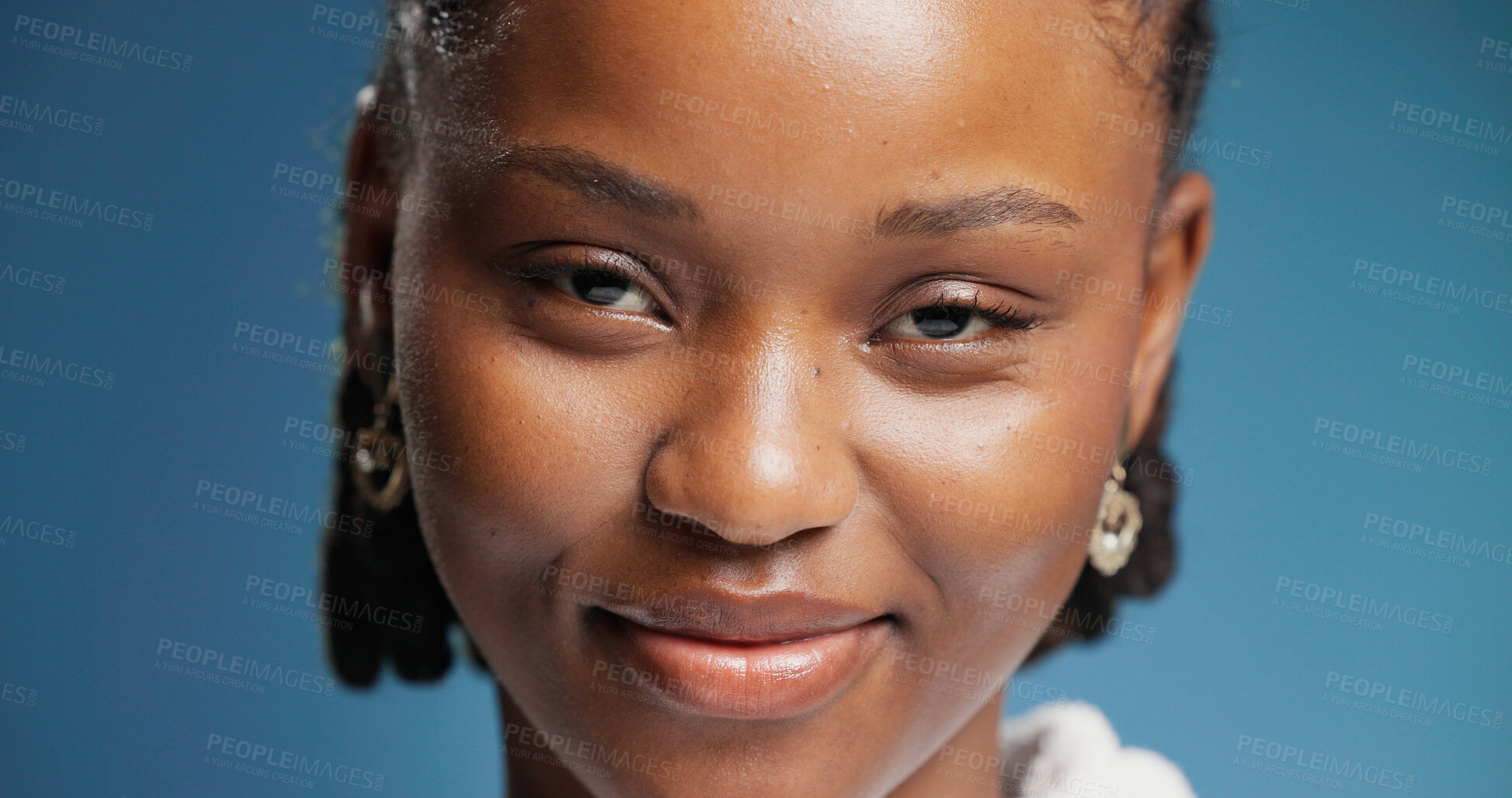 Buy stock photo Smile, woman and portrait with confidence in studio with positive attitude, calm and pride. Face, African female person or happy model on blue background with expression, good mood and wellness.