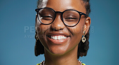 Buy stock photo Smile, portrait or black woman with glasses in studio, vision or frame style for optometry advertising. Shape design, transparent lens or happy person with eyewear for sight, space or blue background