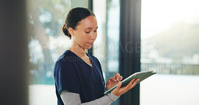 Buy stock photo Search, scroll and tablet with nurse woman in home for healthcare or medical assistance. App, development and medicare with caregiver in apartment for assisted living, homecare support or wellness