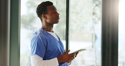 Buy stock photo Homecare, tablet and thinking with nurse black man in living room for hope, planning or vision. App, development and wish with thoughtful African caregiver in apartment for contemplation or decision