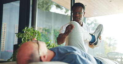 Buy stock photo Leg, help and stretching with old man and physiotherapist for support, chiropractor and rehabilitation. Consulting, physical therapy and recovery with senior patient in clinic for healthcare